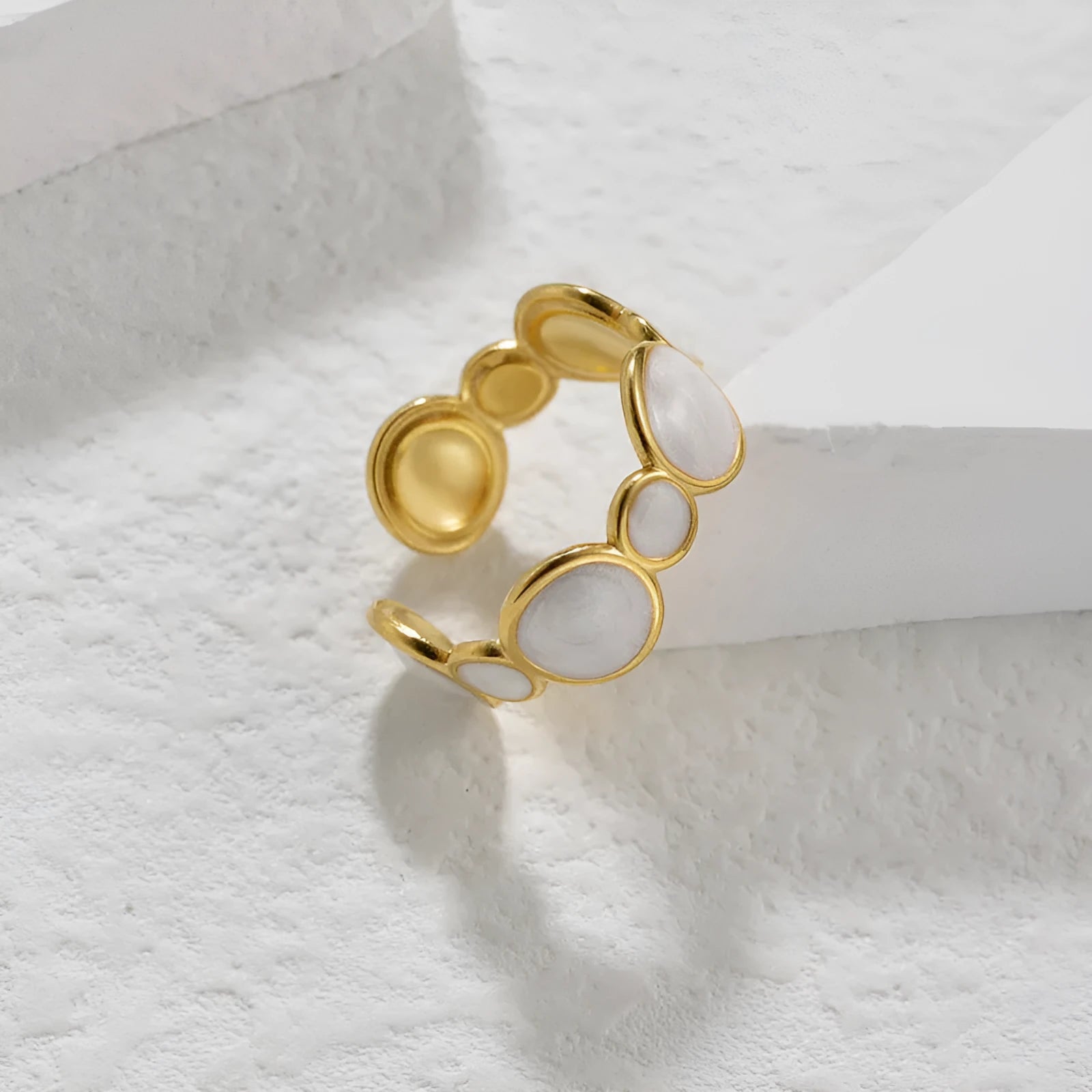 Geometric stainless steel ring with adjustable opening and electroplated metallic finish