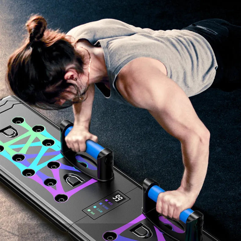 Black multifunctional push-up board for chest and abdominal training measuring 87x43x20cm with TPE soft rubber grips and ABS plastic construction