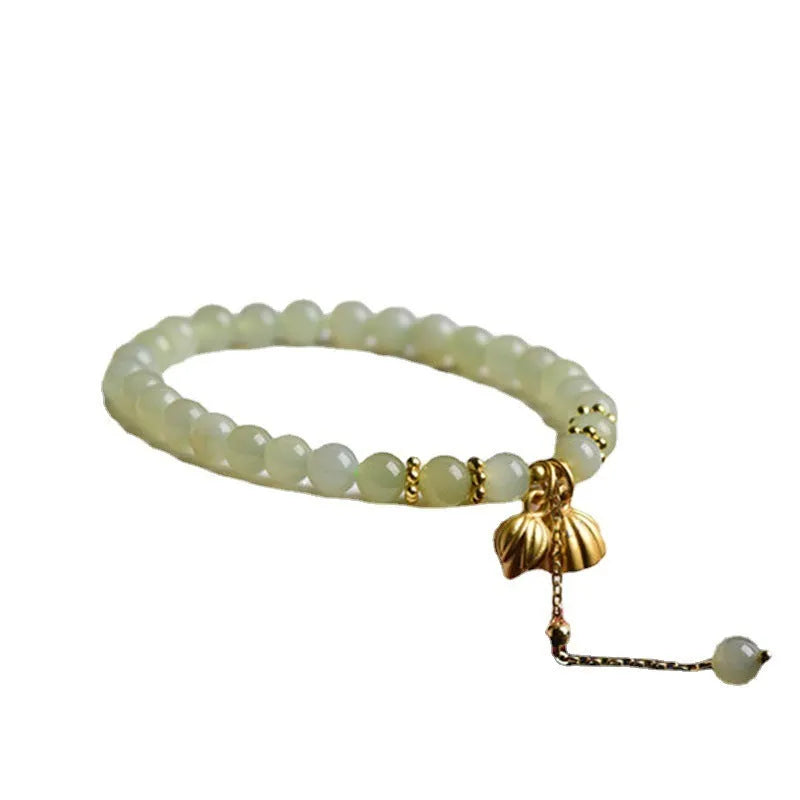 Natural Hetian Jade bracelet with six millimetre beads in step by step lotus pattern