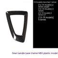 BMW gear selector base frame in carbon fibre pattern left titanium colour, showing 3M adhesive backing.