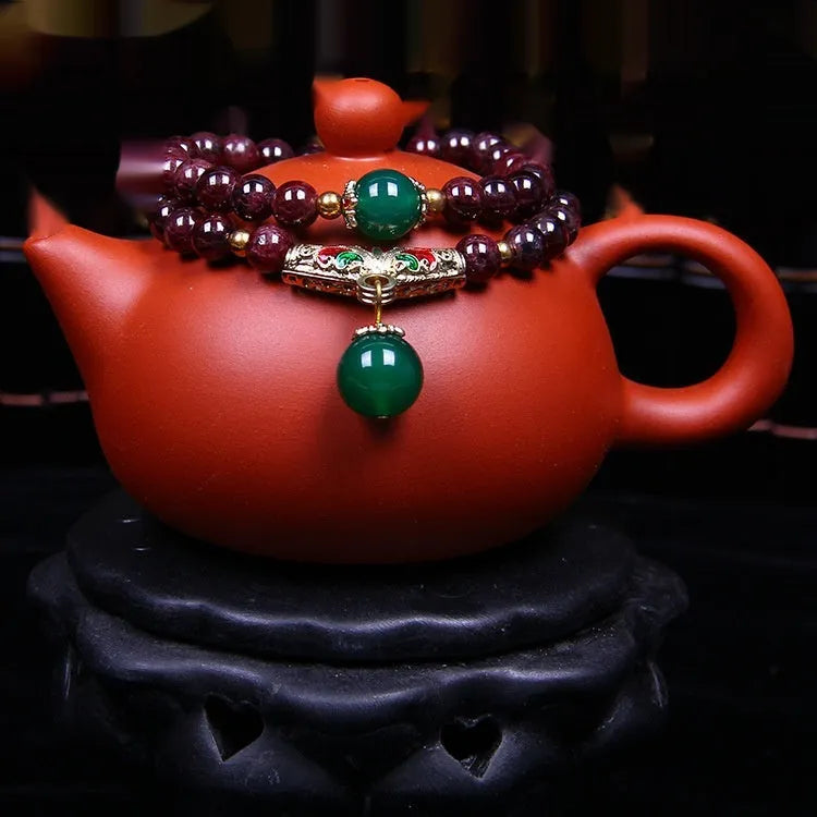 Natural garnet bracelet with 7mm beads, golden toad charm and adjustable double-ring clasp