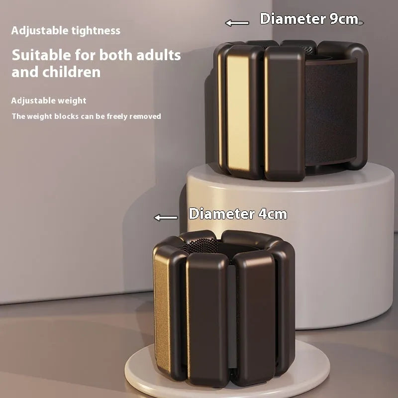 Silicone fitness weight bracelet with Velcro strap shown in pink, black, grey, and blue colour options.