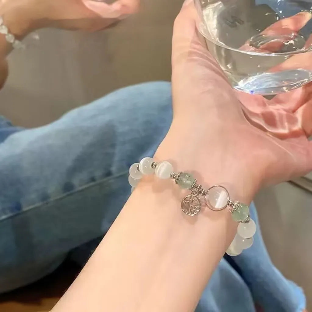 Glass butterfly bracelet for women with drop-shaped coloured glaze beads in grey moonlight colour option