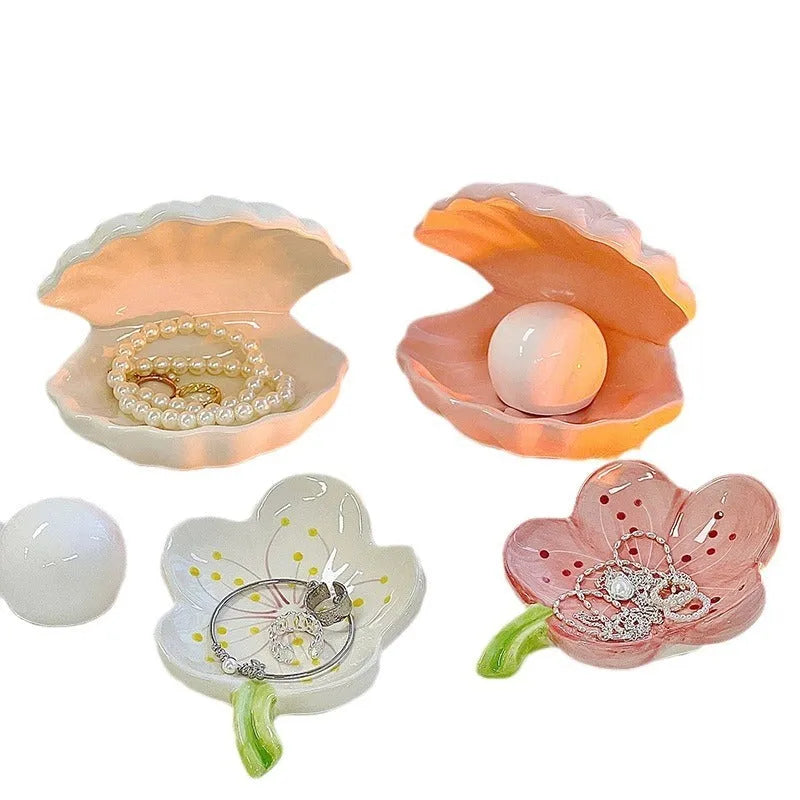 White porcelain storage tray holding a small night light, in yellow, pink, or white colour.