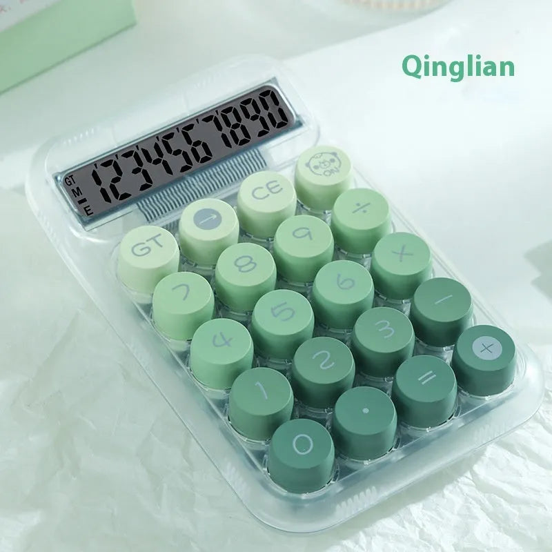 Round keypad gradient colour calculator in blue, green, pink, or purple on a desk.