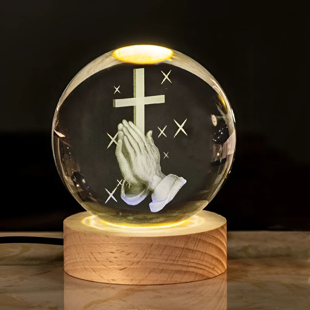 White crystal ball desk ornament with wood base and religious design inside