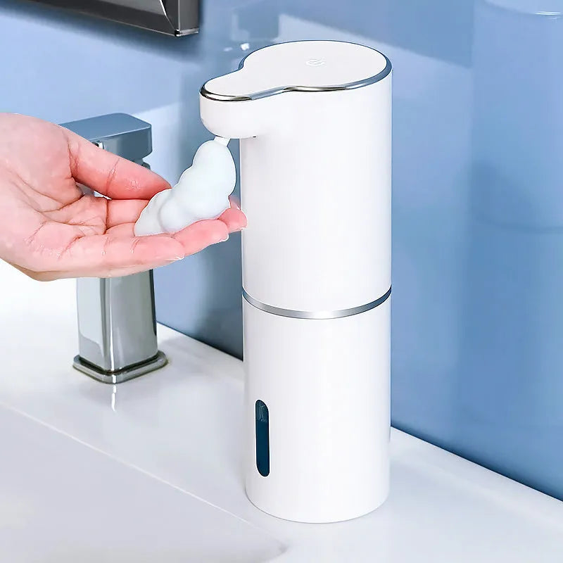 White automatic sensor soap dispenser with ABS body and USB cable on countertop
