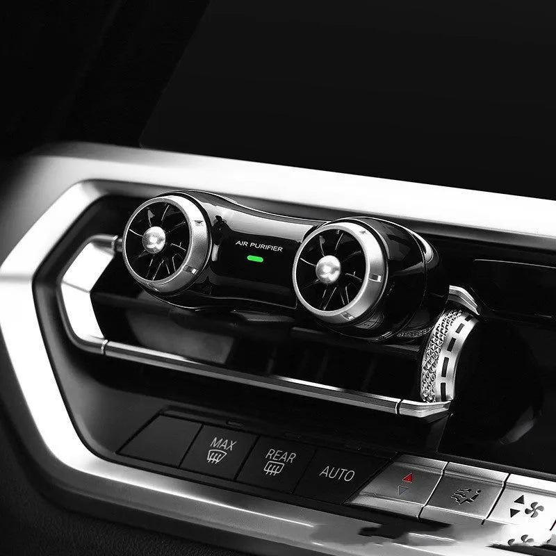 Compact black car air purifier with anion generator and aromatherapy functions
