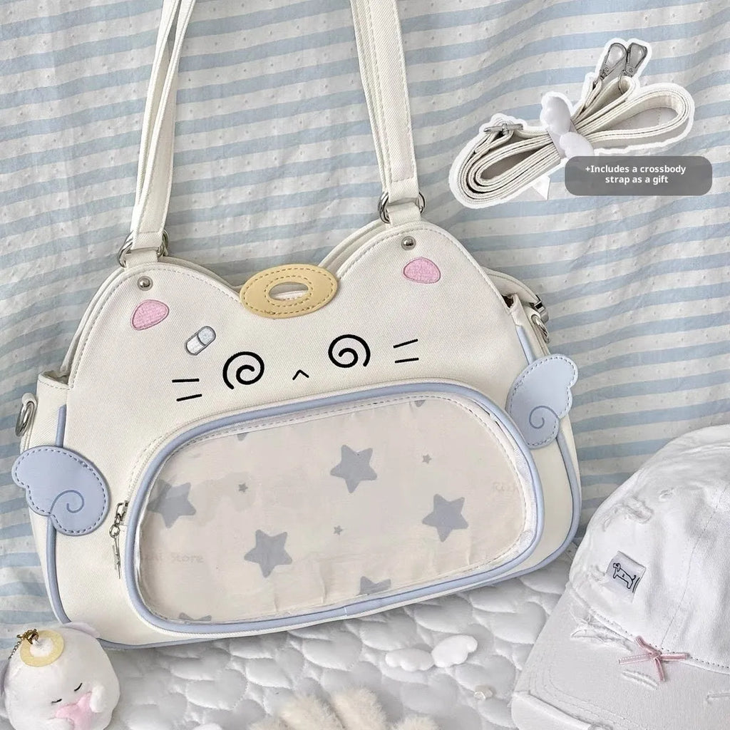 Horizontal cartoon owl pin PU crossbody bag in black, side view showing stitching and single strap