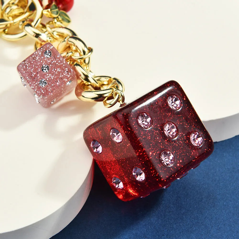 Metal hanging dice keychain pendant in cherry two-tone colour, square shape, vintage style