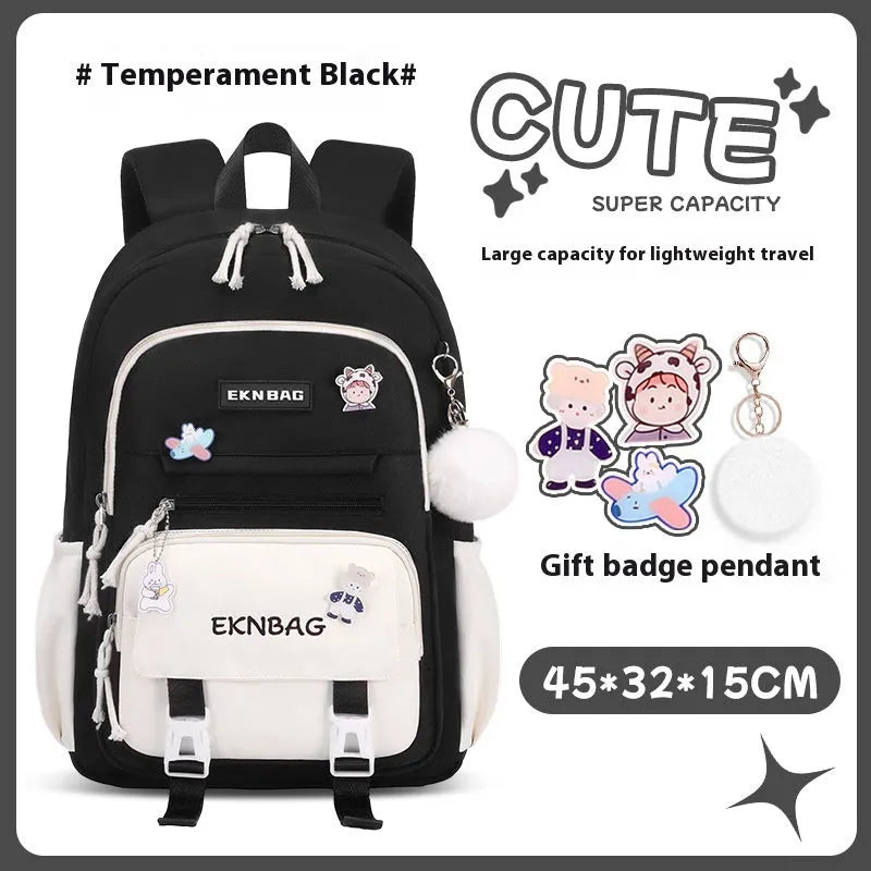 Girls' pink waterproof Oxford cloth school backpack with curved shoulder straps.