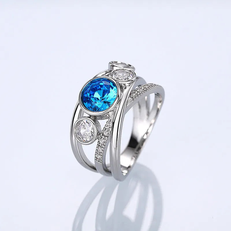 Retro hollow inlaid round copper ring in white gold colour with zircon stones