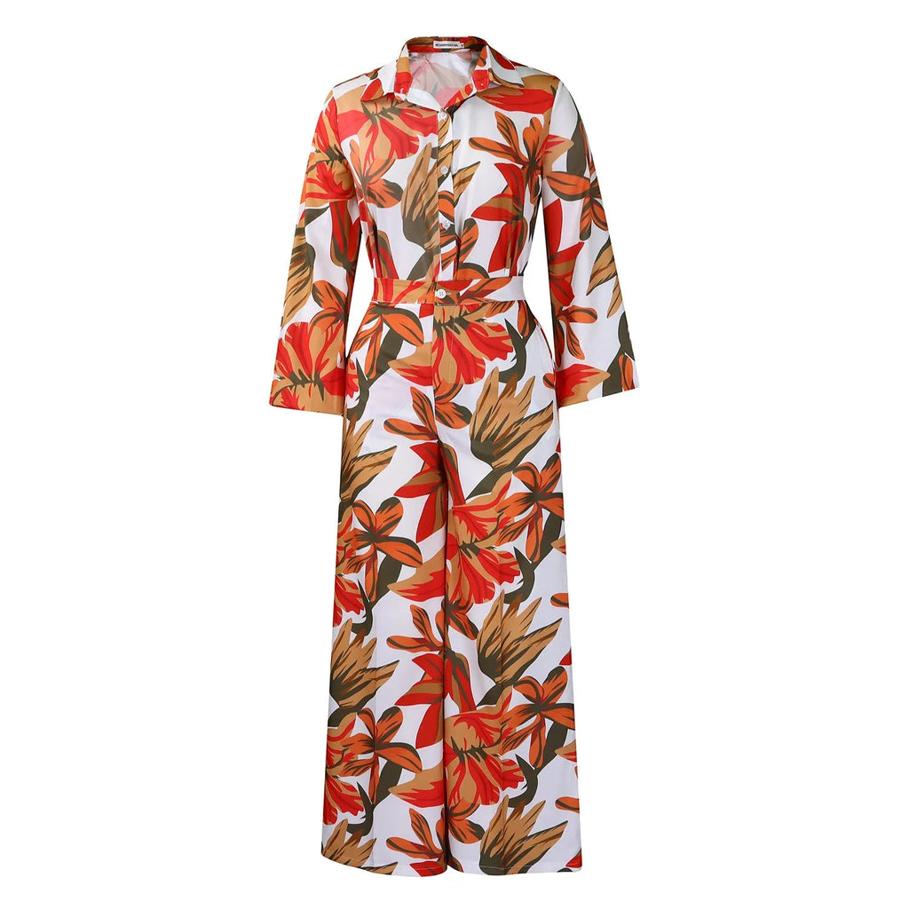 Red printed women's two-piece suit with long sleeve shirt and wide leg trousers on hanger