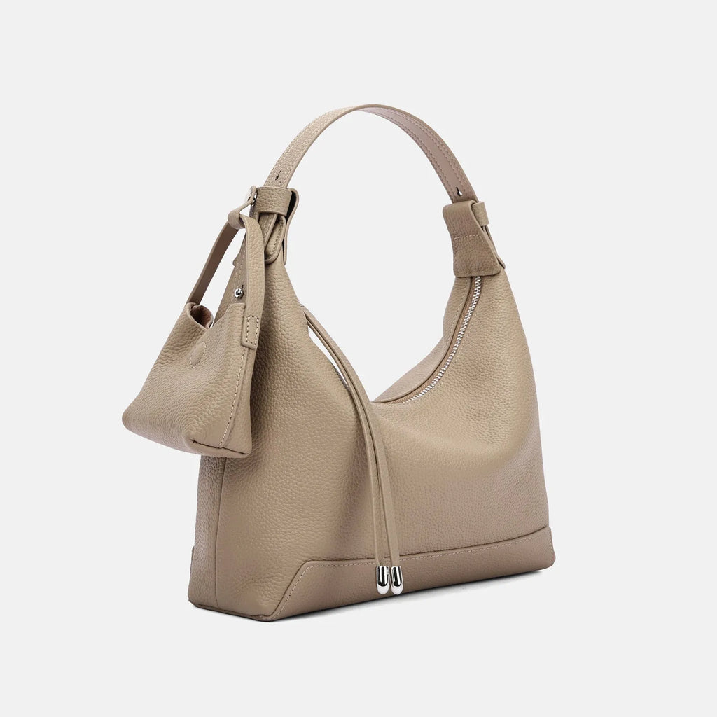 Genuine cowhide leather shoulder bag in urban simplicity style with visible sewing thread details