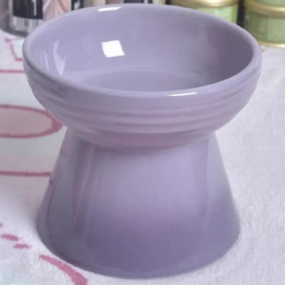 Black ceramic pet bowl with a high foot and neck protector to prevent tipping, shown with flat and slanted rim options.