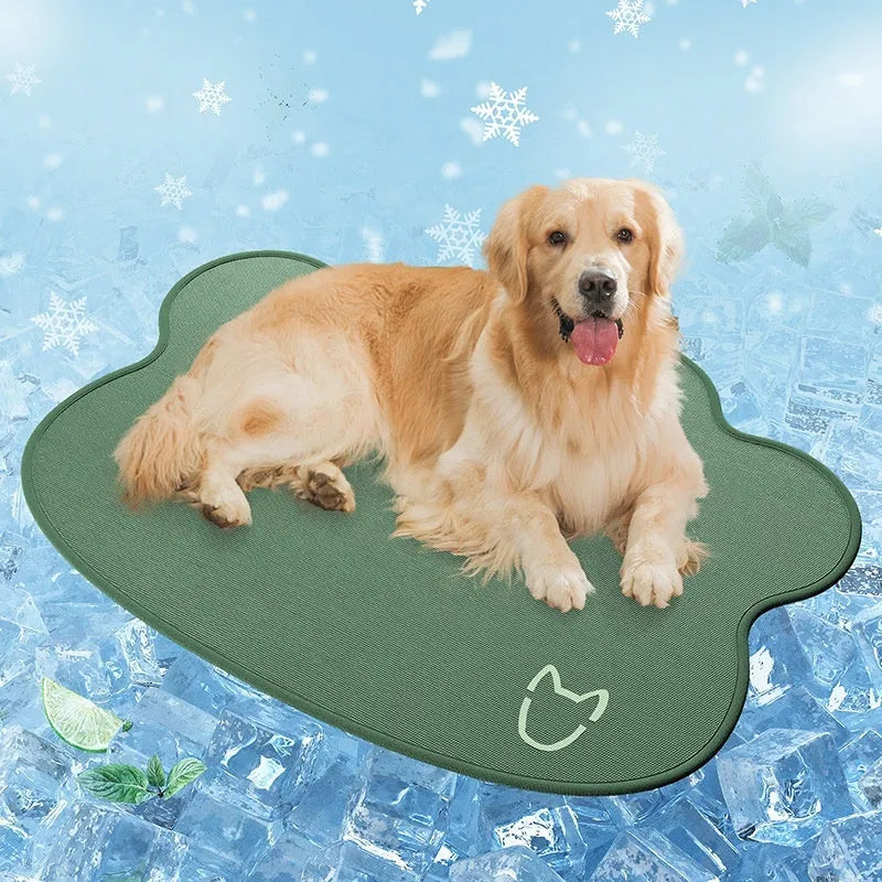 Dog head shaped ice silk cooling mat for pets in grey, green or rice colours on a wooden floor
