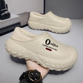 Winter fleece-lined men's home cotton shoes with anti-slip sole, printed letter pattern in black, on a floor