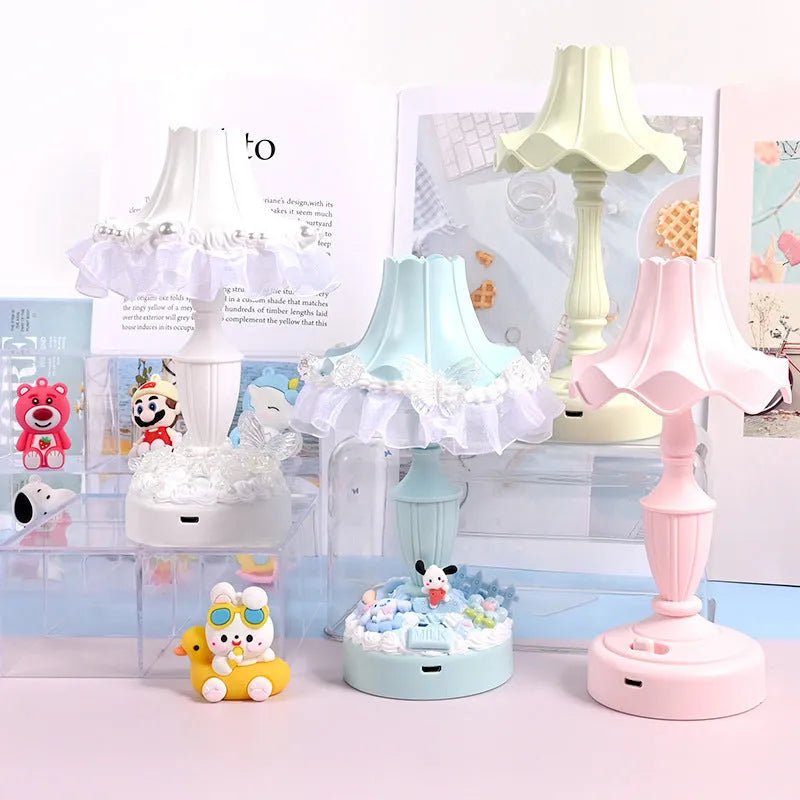 Cute cream retro table lamp with pink floral accents on a desk