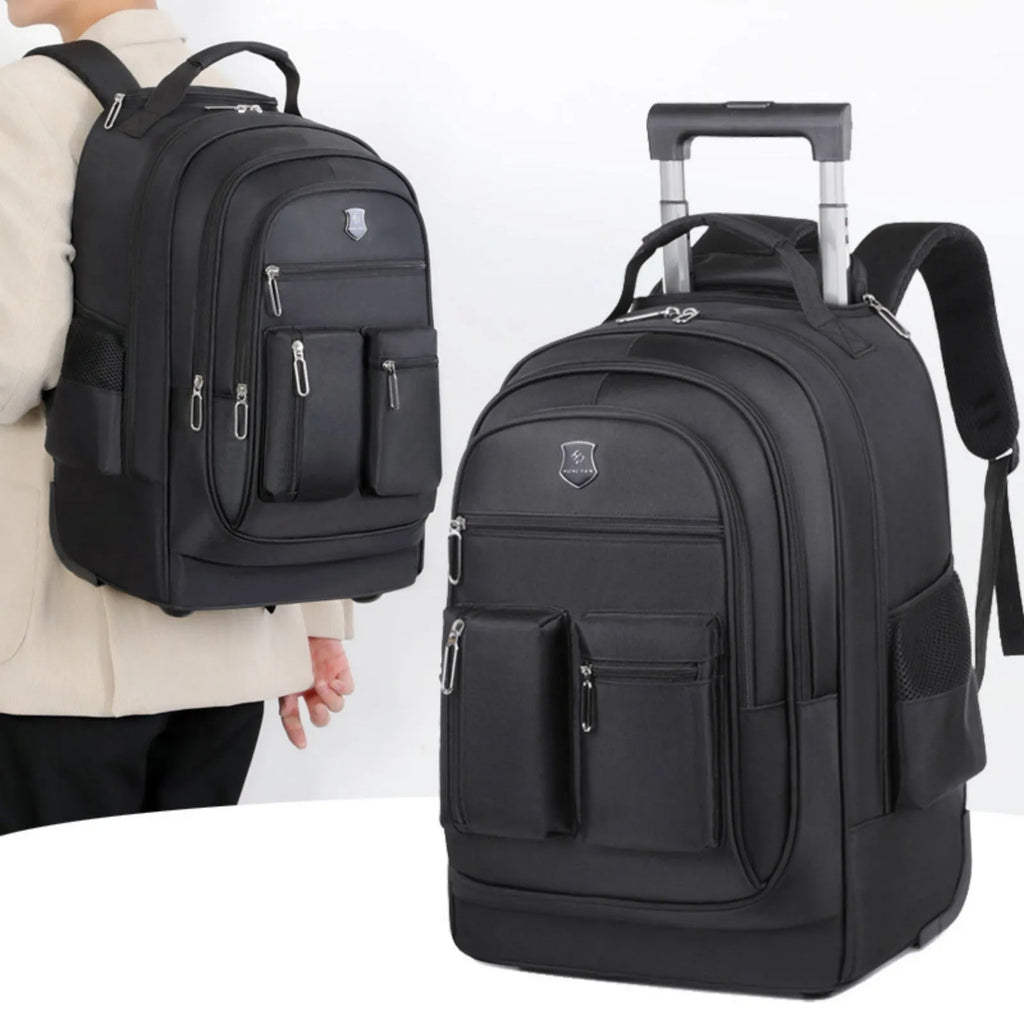 Large capacity multi layer travel backpack with wheels, black colour, standing on a flat surface with telescopic handle extended