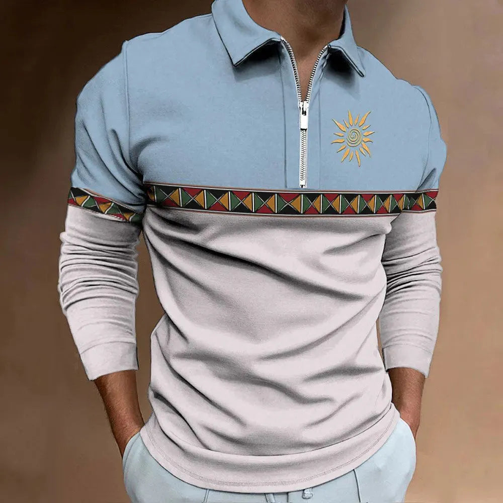 Man wearing a loose-fit long sleeve golf top with retro colour printing and a zipper decoration detail.