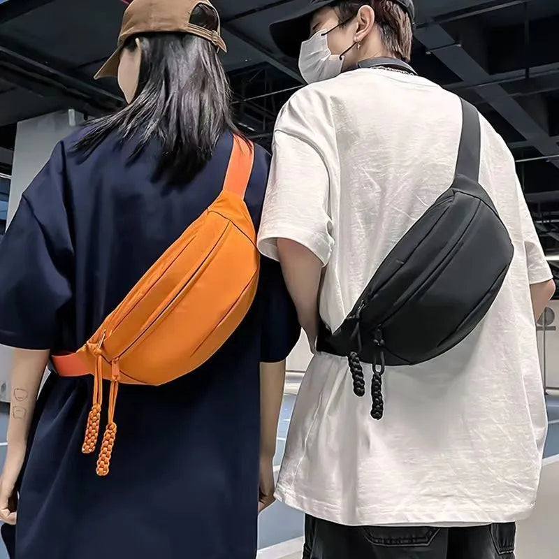 Small men's polyester crossbody chest bag in black with nylon lining and 35cm width