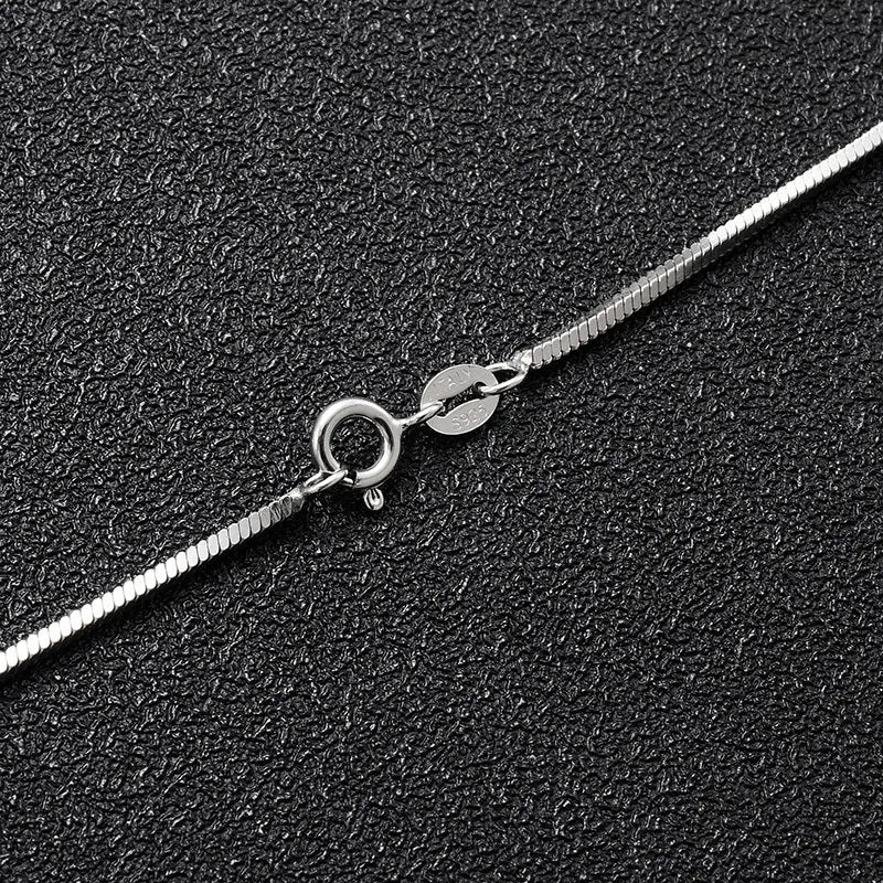S925 sterling silver plated platinum snake bone chain necklace on display, silver colour, unisex design, 45-60cm length options