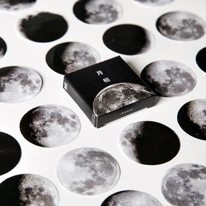 Black moon phase and planet decorative sticker set with 45 pieces on self-adhesive paper.