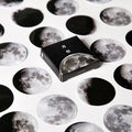 Black moon phase and planet decorative sticker set with 45 pieces on self-adhesive paper.