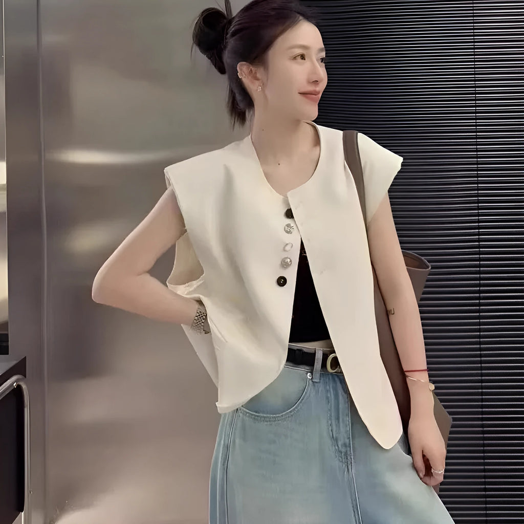 Women's loose fit polyester vest in short length with pockets, shown in milk white colour