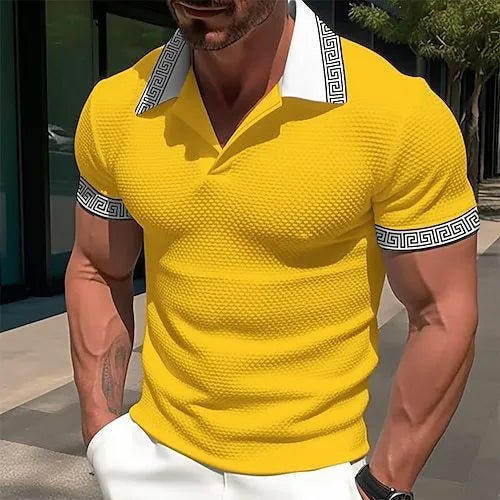 A man wearing a loose-fitting, striped short-sleeved T-shirt for casual summer leisure.