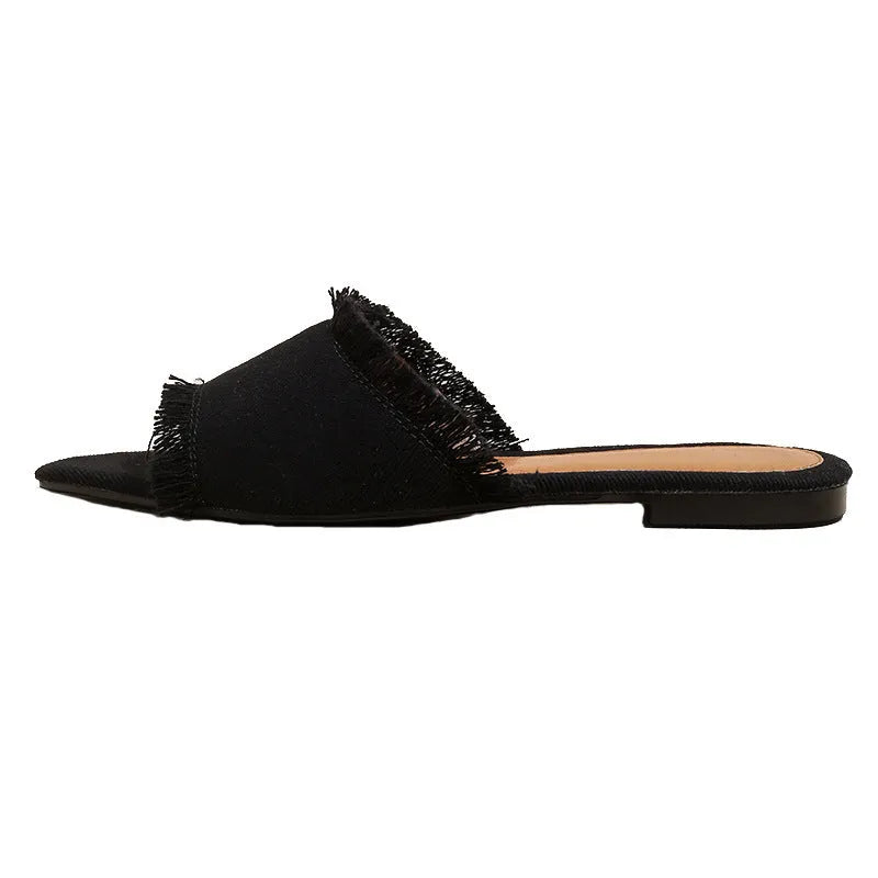 Women's apricot denim slippers with a tassel and leather lining on a lightweight PVC sole.