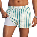 Men's loose fit quick-drying boxer swimming trunks in a selection of floral and tropical print designs.