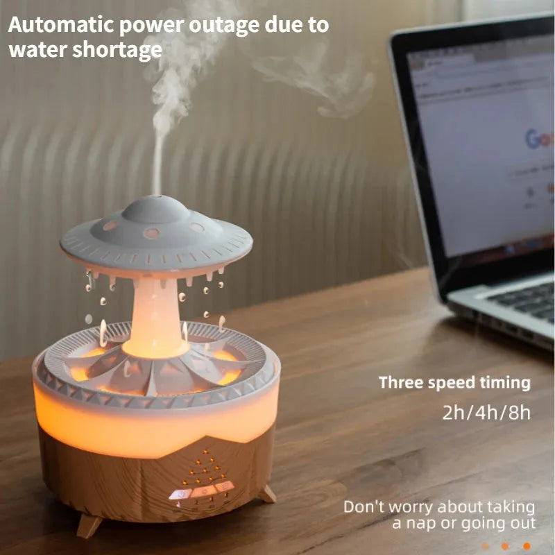 White cloud-shaped UFO raindrop humidifier with water mist and coloured lights