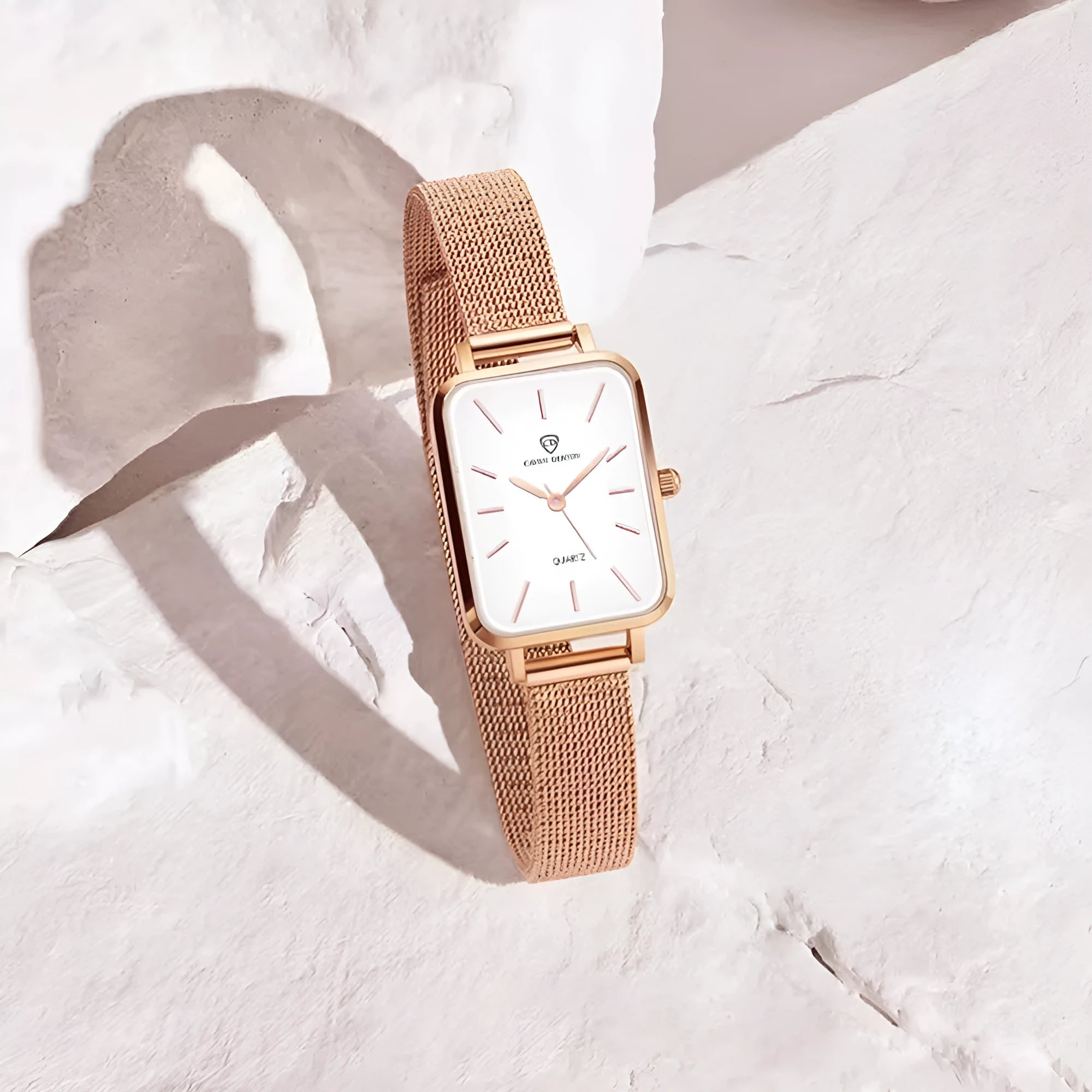 Women's waterproof quartz watch with 34mm alloy case and woven steel strap in rose gold or silver