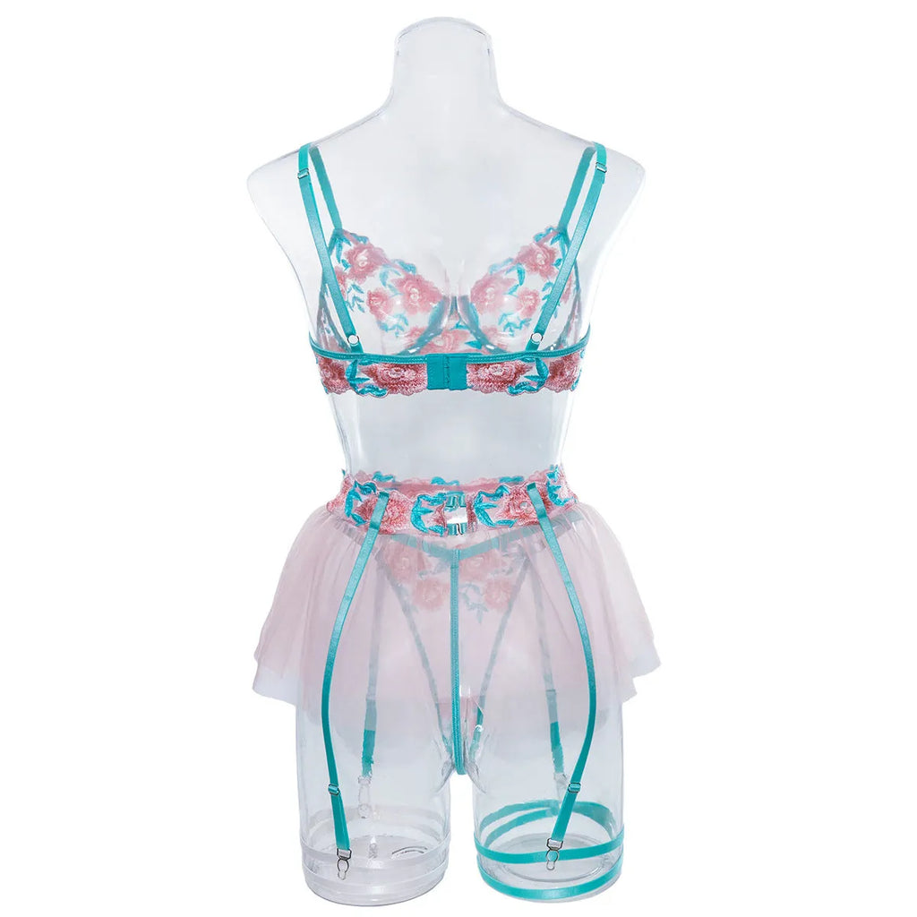 Pink women's mesh pettiskirt suit with matching embroidered bikini set on polyester fabric