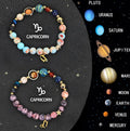 Two natural stone beaded zodiac sign bracelets with astrology theme on neutral background