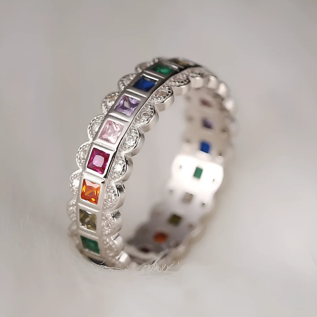 S925 sterling silver adjustable lace ring with rainbow zircon stones on a white background.