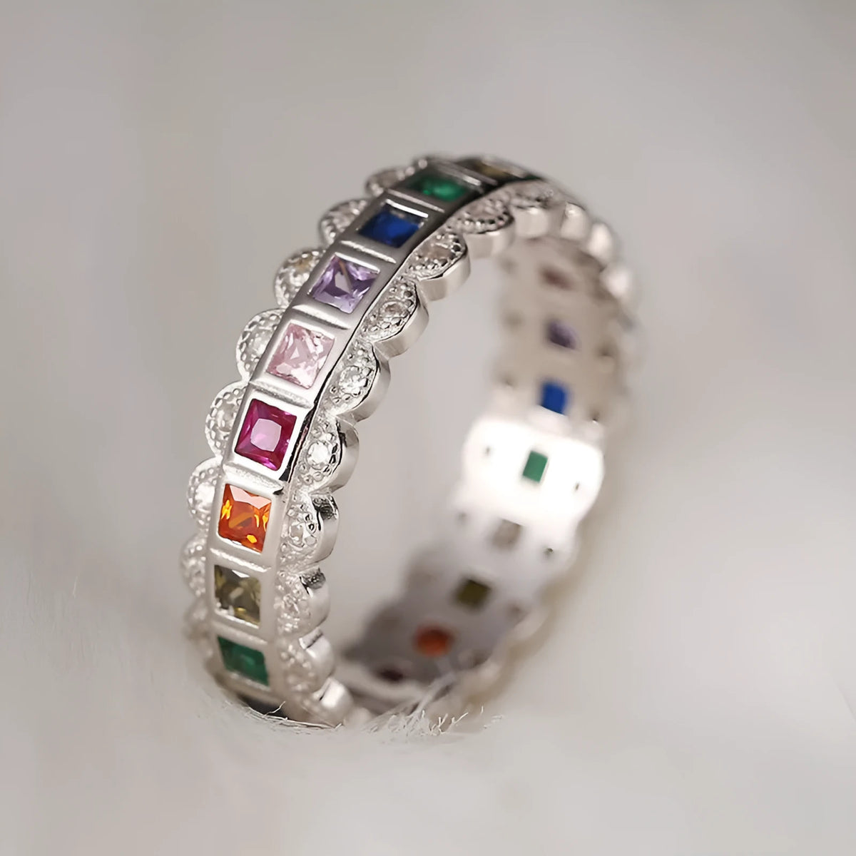 S925 sterling silver adjustable lace ring with rainbow zircon stones on a white background.