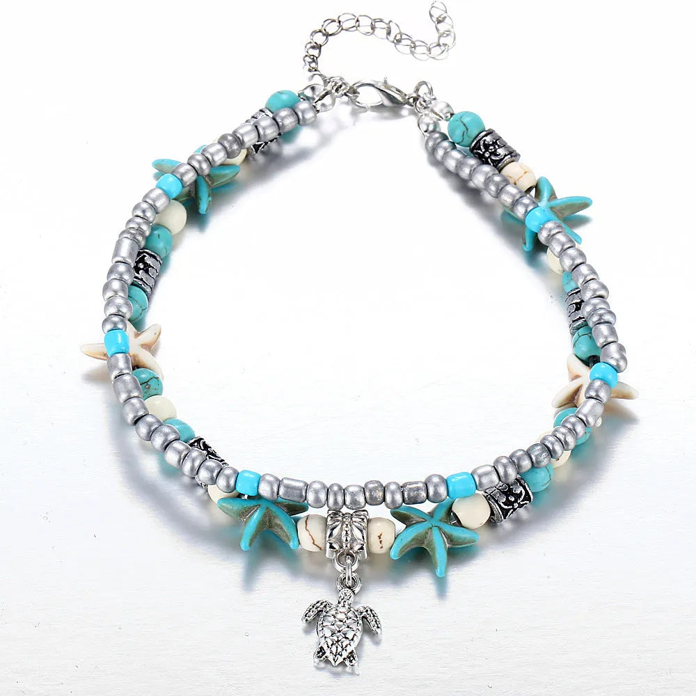 Green blue starfish anklet leg chain with zinc alloy construction on a beach setting