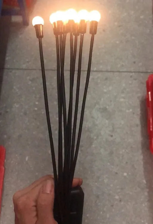 Solar-powered LED garden light with ground spike for soil installation in warm white or coloured lighting options