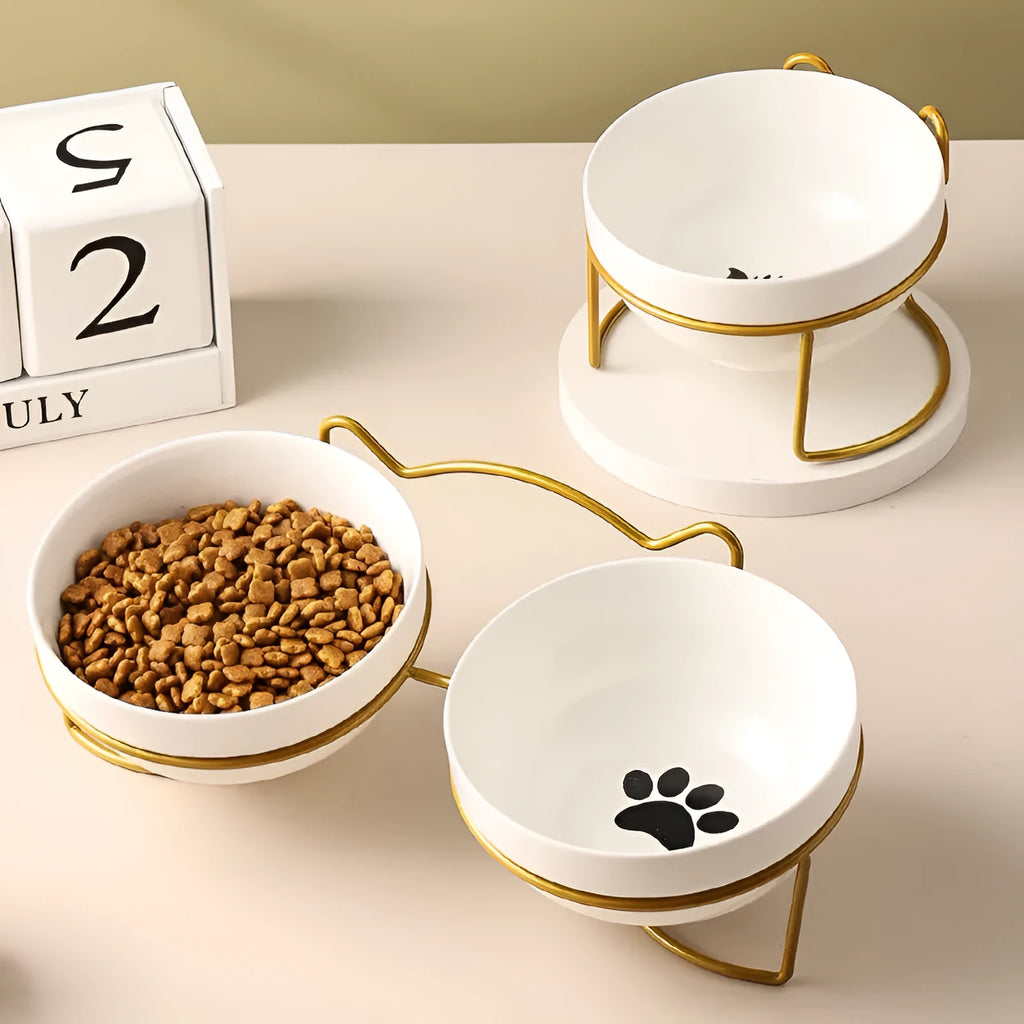 White ceramic cat bowl with decorative iron frame in cat ear design
