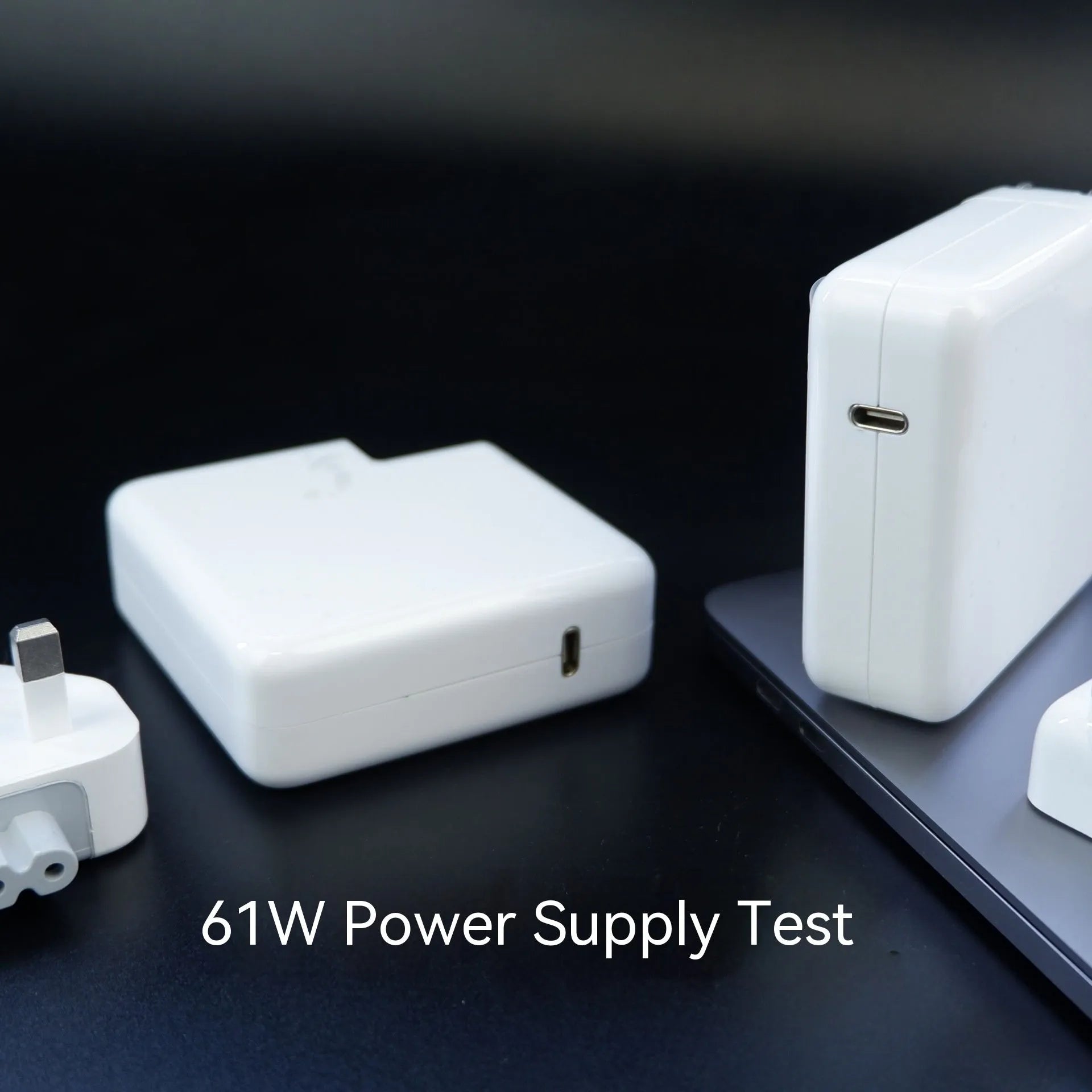 61W USB-C laptop power adapter with international plug options and white cable