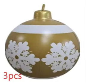 Large red and white striped inflatable Christmas ball ornament hanging on an outdoor tree