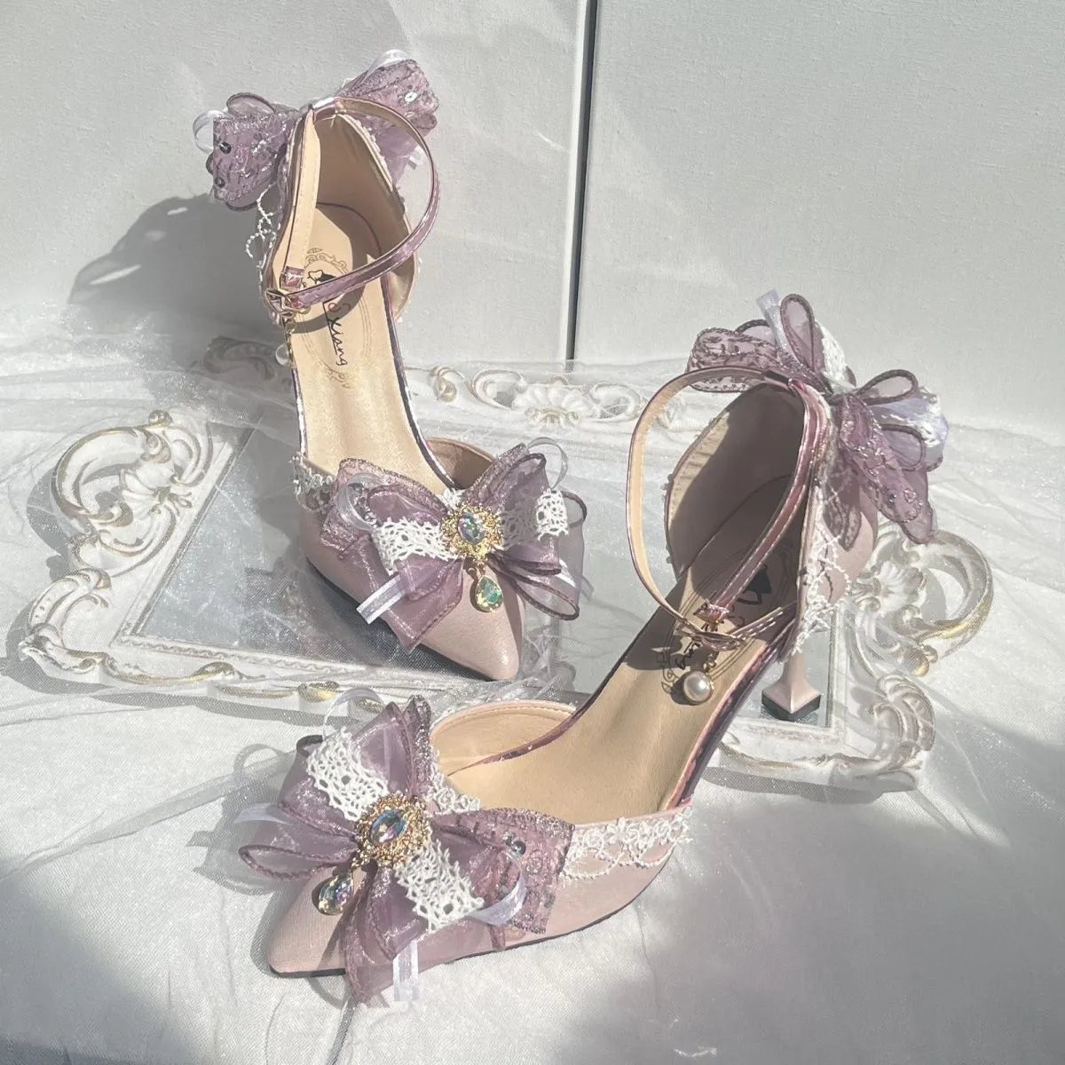 Purple satin Lolita shoes with a stiletto heel and square toe on a white background.