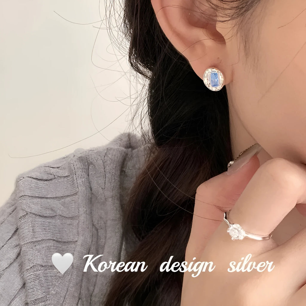 S925 sterling silver oval earrings with blue diamond heart-wrapped geometric design