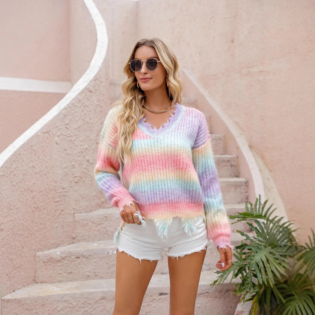 Pink rainbow gradient acrylic knitted pullover sweater with loose cut silhouette and tassel details