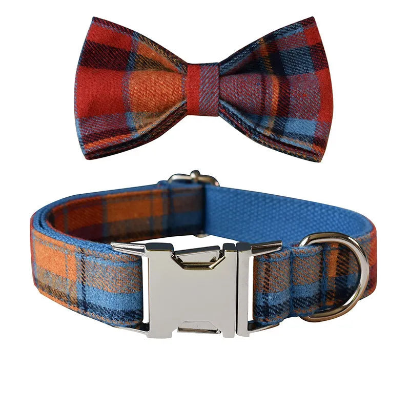 Blue background velvet plaid dog collar with a silver alloy buckle on a size tag.