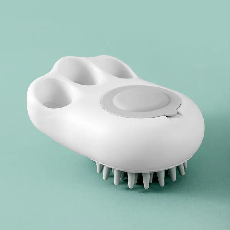Blue pet bath and massage brush with silicone bristles and an ergonomic non-slip handle.