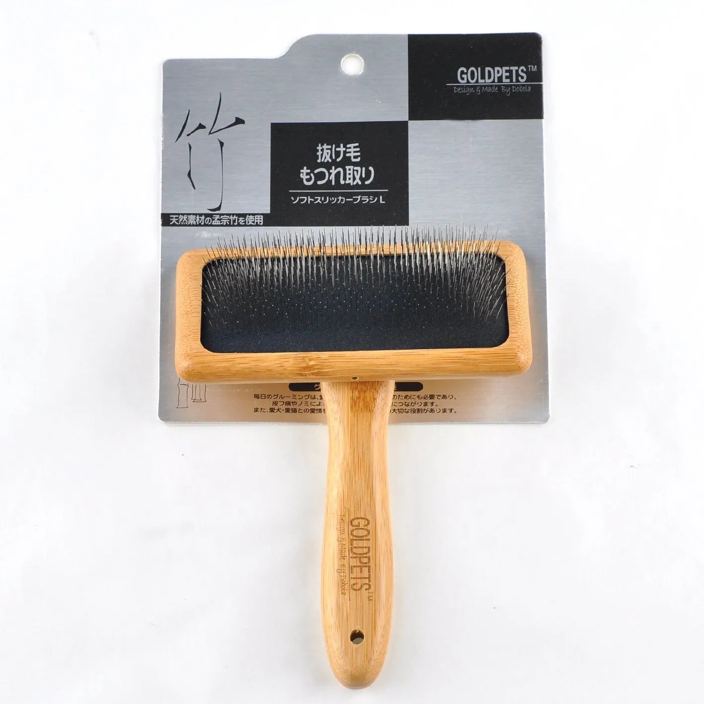 Pet grooming bamboo wood air cushion needle comb with original bamboo colour handle and steel pins on a clean background