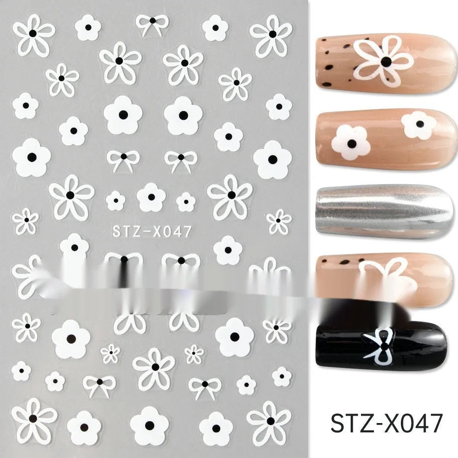 Black and silver stripe nail art sticker with a love pattern design on a plastic sheet.